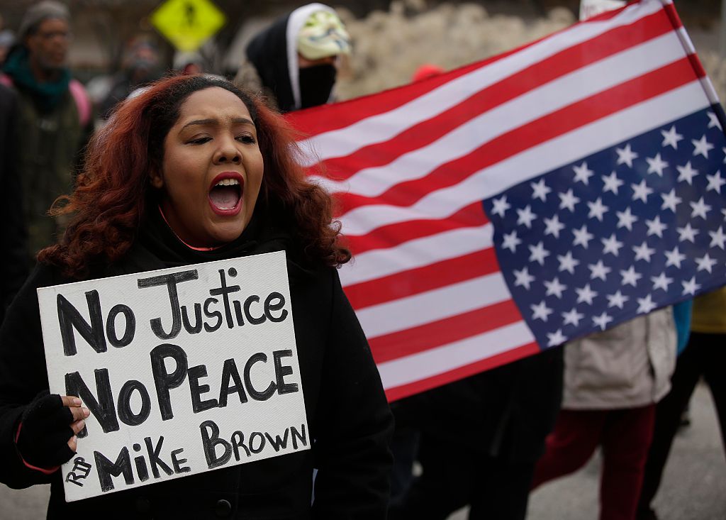 Ferguson Police Officer Fights For Life After Michael Brown Protest Devolves Into Riot