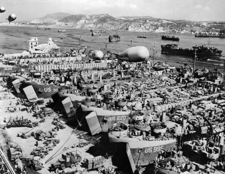 Elevated view of an unspecified port, where a flotilla of Allied LSTs (Landing Ship, Tanks) are prepared for Operation Dragoon, Italy, August 1944. The operation, the invasion of France's southern coastline, was to set begin on August 15, 1944. Visible above are barrage balloons to protect the vessels from air attacks. (Photo by Underwood Archives/Getty Images)