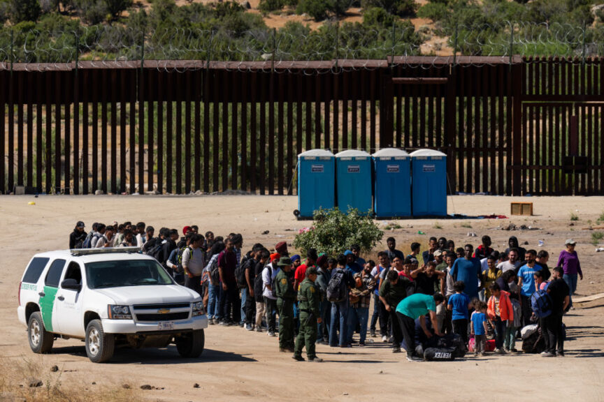 JACUMBA HOT SPRINGS, CA - JUNE 14: Migrants wait to be processed by U.S. Border Patrol agents after crossing into the U.S. from Mexico on June 14, 2024 in Jacumba Hot Springs, California. U.S. President Joe Biden on June 4 unveiled immigration order severely limiting asylum-seeker crossings. (Photo by Qian Weizhong/VCG via Getty Images)