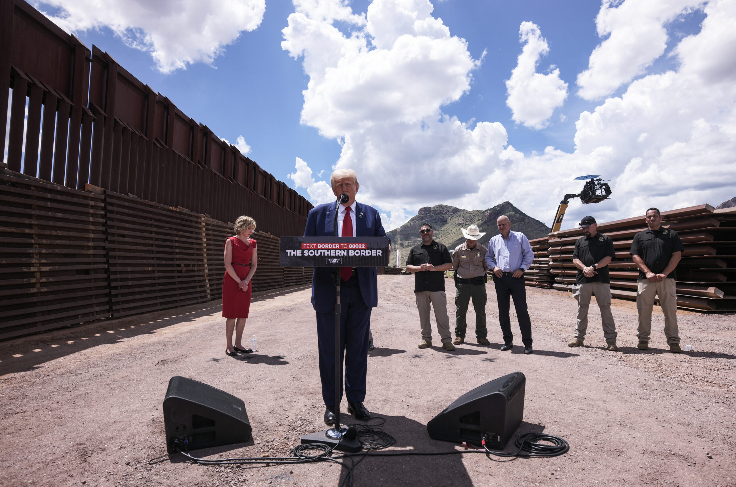 Former U.S. President and Republican presidential candidate Donald Trump (2L) speaks about immigration and border security at Coronado National Memorial in Montezuma Pass, Arizona, August 22, 2024. (Photo by OLIVIER TOURON/AFP via Getty Images)