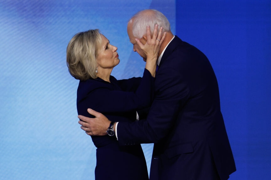 Democratic vice presidential candidate Minnesota Gov. Tim Walz embraces his wife, Minnesota first lady Gwen Walz after speaking on stage during the third day of the Democratic National Convention at the United Center on August 21, 2024 in Chicago, Illinois. (Photo by Chip Somodevilla/Getty Images)