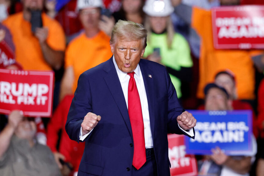 TOPSHOT - Former US President and Republican presidential candidate Donald Trump dances as he walks on stage during a campaign rally at Van Andel Arena in Grand Rapids, Michigan on November 5, 2024. (Photo by KAMIL KRZACZYNSKI / AFP) (Photo by KAMIL KRZACZYNSKI/AFP via Getty Images)