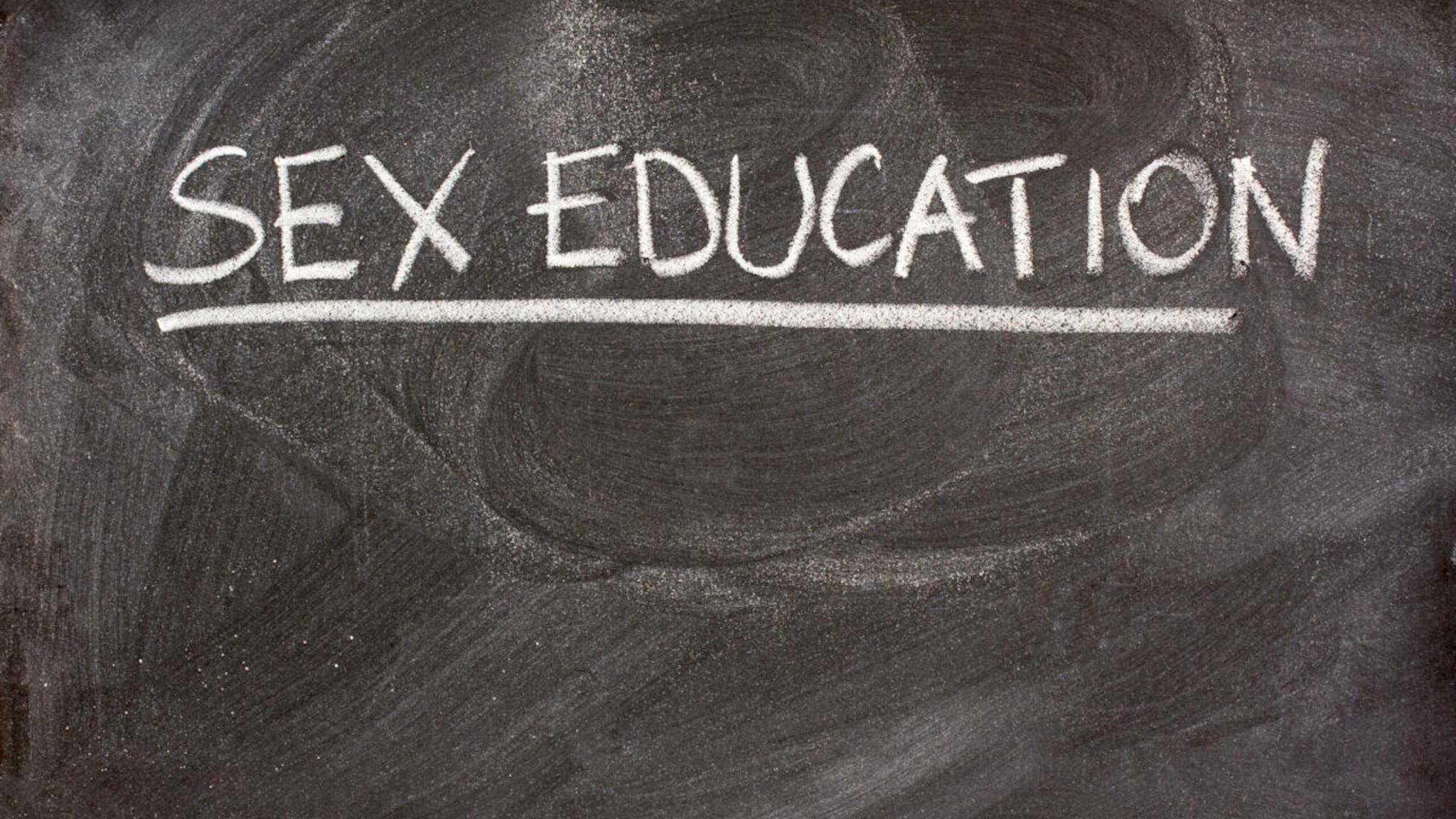 sex education sex education handritten with white chalk as a class or lecture topic on blackboard