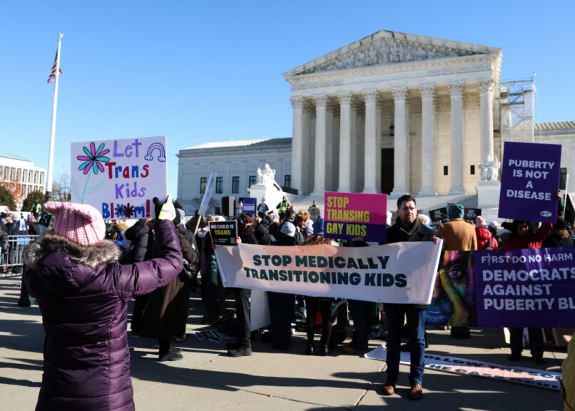 WASHINGTON, DC - DECEMBER 04: Transgender rights supporters and opponent rally outside of the U.S. Supreme Court as the high court hears arguments in a case on transgender health rights on December 04, 2024 in Washington, DC. The Supreme Court is hearing arguments in US v. Skrmetti, a case about Tennessee's law banning gender-affirming care for minors and if it violates the Constitution’s equal protection guarantee.