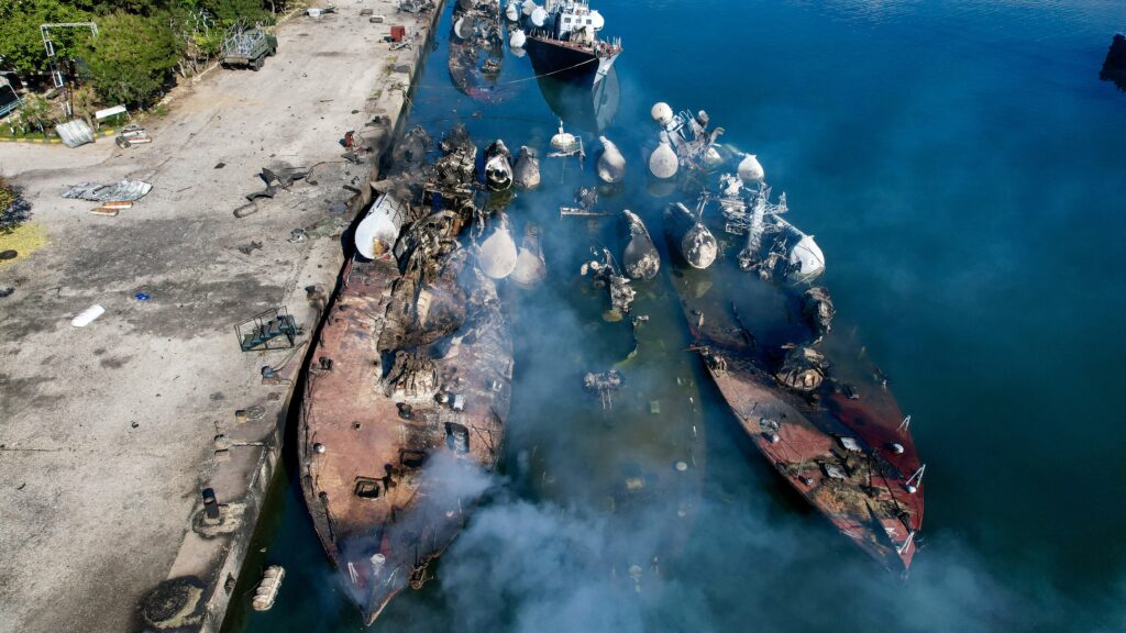 TOPSHOT - An aerial photo shows Syrian naval ships destroyed during an overnight Israeli attack on the port city of Latakia on December 10, 2024. The UN special envoy for Syria on December 10 called on Israel to halt its military movements and bombardments inside Syria, days after the fall of president Bashar al-Assad. (Photo by AAREF WATAD / AFP) (Photo by AAREF WATAD/AFP via Getty Images)