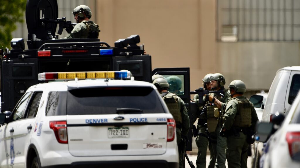 DENVER, CO. - May 14, 2015: Denver SWAT ready to arrest two people on felony warrants after they barricaded themselves in a home at 4646 Logan St, Globeville. They suspects surrendered to SWAT. Denver May 14, 2015 Denver, CO