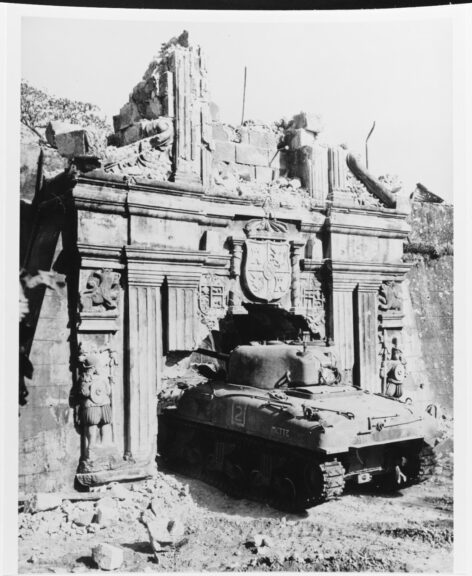 Liberation of Manila, 1945. A U.S. Army M-4 "Sherman" tank enters Old Fort Santiago through a somewhat enlarged gate, 26 February 1945. Note crest carved over the gate, and extensive damage. Catalog #: 80-G-273361. Copyright Owner: National Archives. Mon, Feb 26, 1945. National Archives. Naval History and Heritage Command.