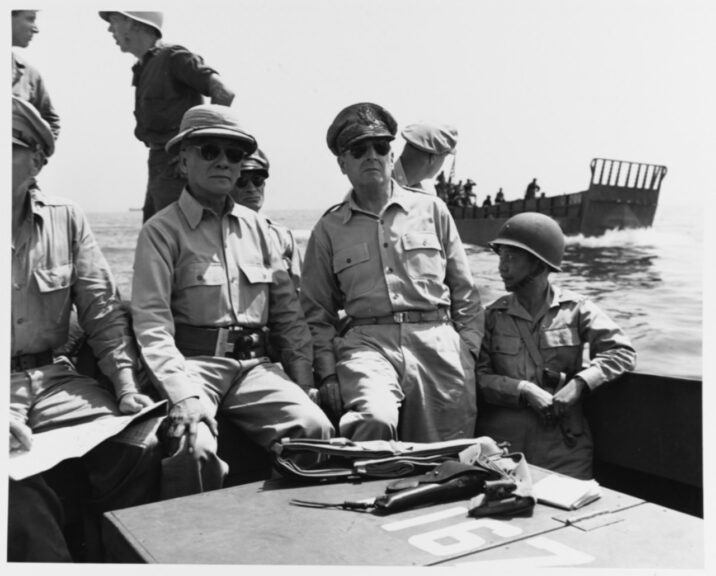 Leyte Invasion, October 1944. General Douglas Macarthur and Philippine president Sergio Osmena in a landing craft on their way to ceremonies proclaiming the liberation of Leyte, 23 October 1944. On the right is Brigadier General Carlos P. Romulo. Catalog #: 80-G-289537. National Archives. Mon, Oct 23, 1944. National Archives. Naval History and Heritage Command.