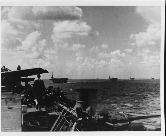 Mindoro Operation, December 1944. Caption: Escort carriers of task group 77.12.7 getting under way from the Palau Islands, en route for the invasion of Mindoro, 10 December 1944. Photographed from USS KADASHAN BAY (CVE-76). Catalog #: 80-G-301022. National Archives. Naval History and Heritage Command.