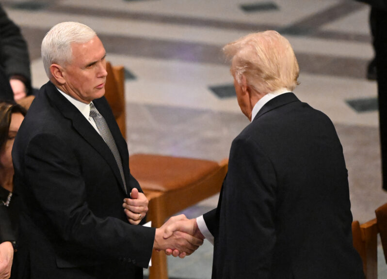 Former US Vice President Mike Pence (L) shakes hands with President-elect Donald Trump before a State Funeral Service for former US President Jimmy Carter at the Washington National Cathedral in Washington, DC, on January 9, 2025. (Photo by Mandel NGAN / POOL / AFP) (Photo by MANDEL NGAN/POOL/AFP via Getty Images)