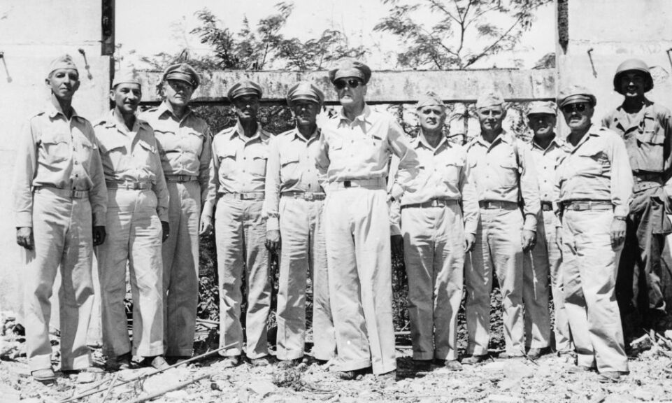 March 1945: American General Douglas MacArthur (1880 - 1964) with members of his staff standing amid the rubble of his former home in the Philippines after fullfilling his promise to return to defeat the Japanese Invaders. (Photo by Central Press/Getty Images)