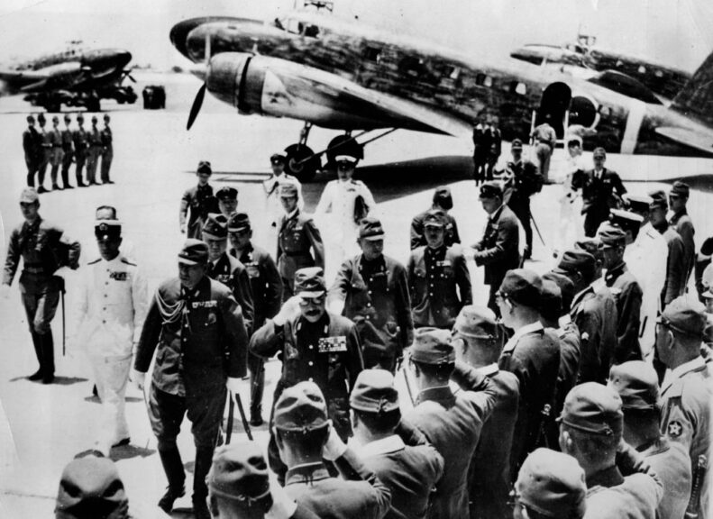 May 1943: Premier Tojo arriving in Manila. He responds to the salute from General Waui Ehk of the Japanese Administration and the Commander of the Imperial Japanese Fleet (in the white uniform). (Photo by Hulton Archive/Getty Images)