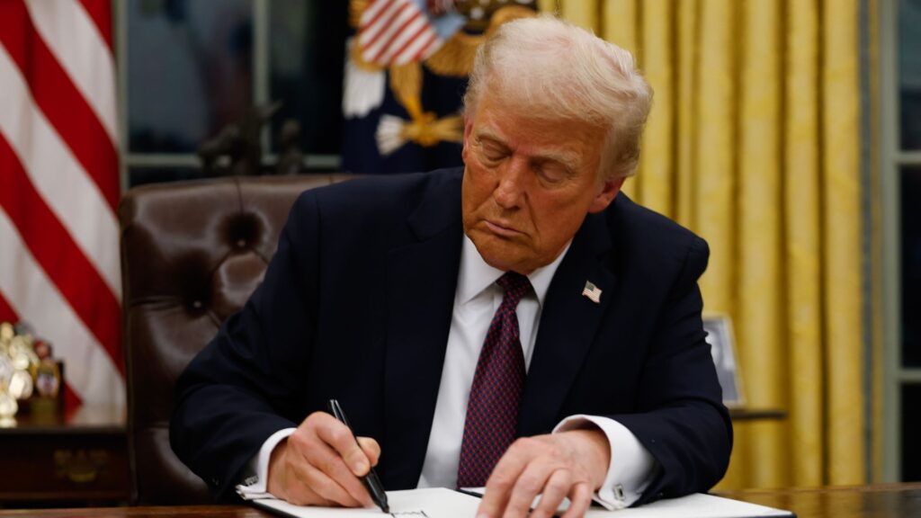 President Donald Trump signs executive orders in the Oval Office of the White House on January 20, 2025 in Washington, DC.