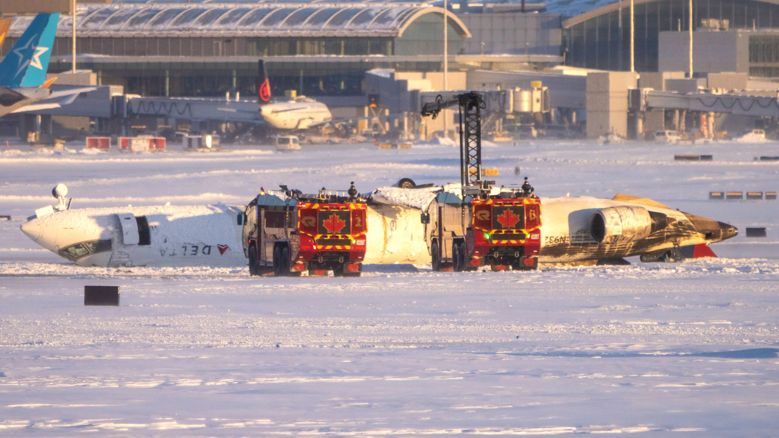 TORONTO, CANADA - FEBRUARY 17: Emergency personnel work at the scene of a Delta Airlines plane crash at Toronto Pearson International Airport on February 17, 2025 in Toronto, Canada. Several passengers were injured on the flight arriving from Minneapolis, resulting in the suspension of all flights at Canada's busiest airport.