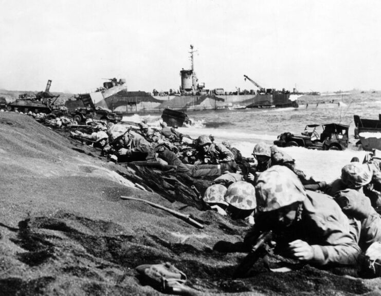 U.S. Marines lying on the beach of Iwo Jima bombarded by Japanese artillery. Iwo Jima, February 1945 (Photo by Mondadori via Getty Images)