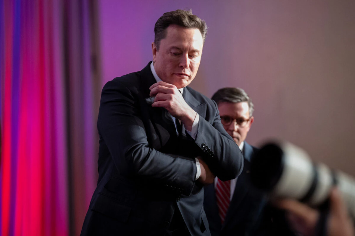 U.S. Speaker of the House Mike Johnson (R) escorts Elon Musk (C) as he arrives with U.S. President-elect Donald Trump to a House Republicans Conference meeting at the Hyatt Regency on Capitol Hill on November 13, 2024 in Washington, DC.