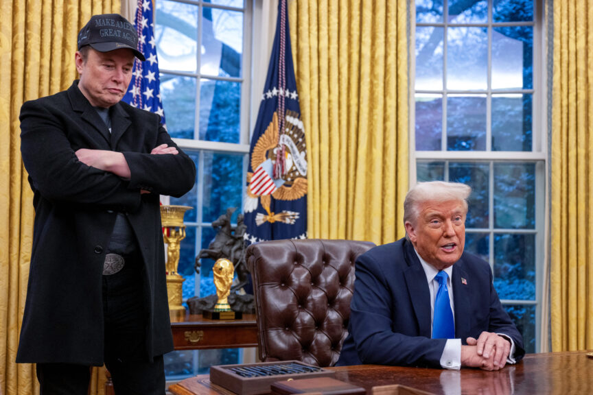 Elon Musk listens as US President Donald Trump speaks in the Oval Office of the White House in Washington, DC, on February 11, 2025. Tech billionaire Elon Musk, who has been tapped by President Donald Trump to lead federal cost-cutting efforts, said the United States would go "bankrupt" without budget cuts. Musk leads the efforts under the newly created Department of Government Efficiency (DOGE), and was speaking at the White House with Trump, who has in recent weeks unleashed a flurry of orders aimed at slashing federal spending.