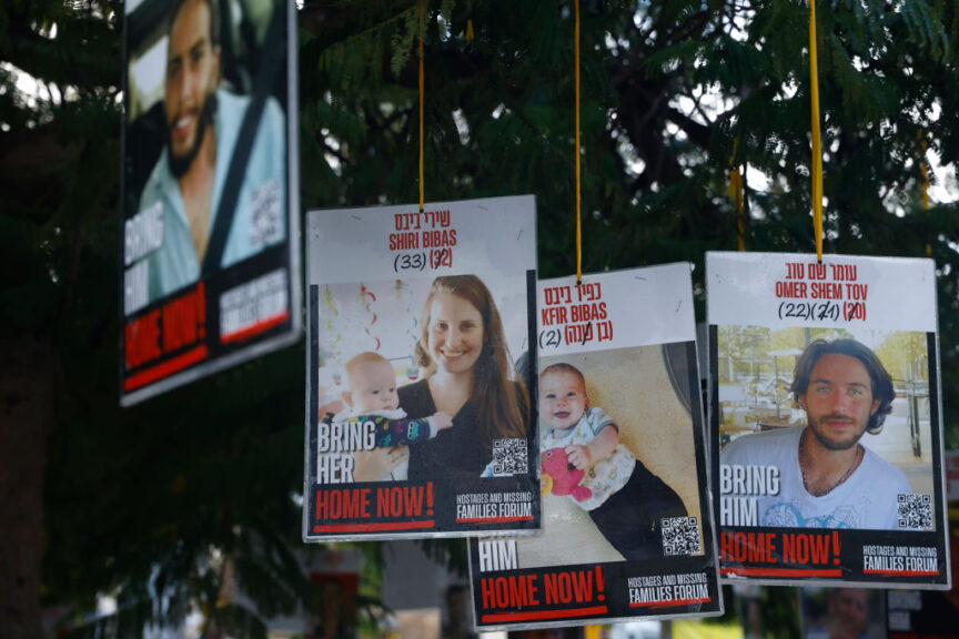 TEL AVIV, ISRAEL - FEBRUARY 20: Poster of hostages Shiri Bibas, Kfir Bibas and Omer Shem Tov are displayed in hostages square prior the handover of four bodies taken by Hamas fighters on February 20, 2025 in Tel Aviv, Israel. Four bodies of hostages believed to include those of the Bibas family - Shiri and her young children Kfir and Ariel taken by Hamas fighters in the October 7 raids on Israel are released from Gaza. President Netanyahu has said it "..will be a very difficult day for the state of Israel. An upsetting day, a day of grief. We bring home four of our beloved hostages, deceased. We embrace the families, and the heart of an entire nation is torn. My heart is torn." (Photo by Amir Levy/Getty Images)