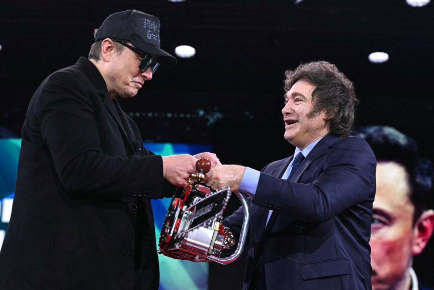 Elon Musk (L) holds a chainsaw with Argentine President Javier Milei during the annual Conservative Political Action Conference (CPAC) at the Gaylord National Resort & Convention Center at National Harbor in Oxon Hill, Maryland, on February 20, 2025.