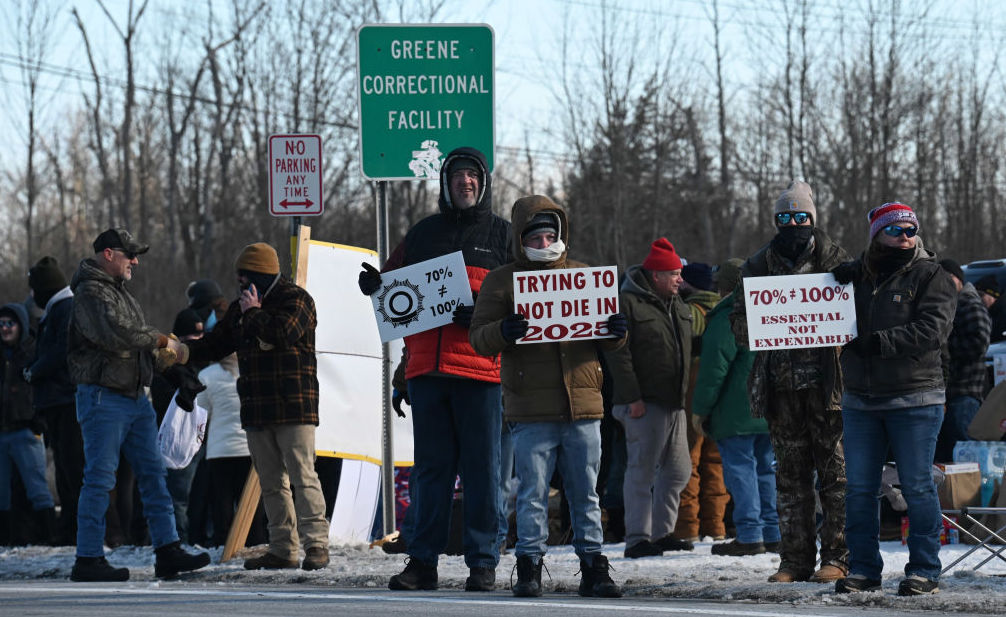 Striking correction officers and their supporters stage a protest along Route 9W near Greene Correctional Facility state prison on Wednesday, Feb. 19, 2025, in Coxsackie, N.Y.