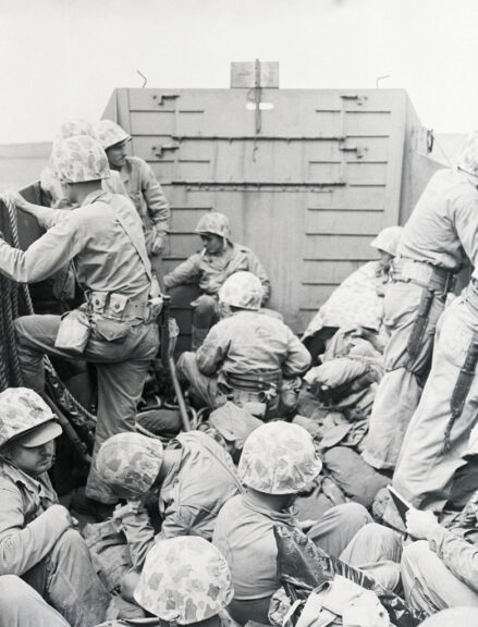 (Original Caption) 2/25/45-Iwo Jima: Marines of the fifth Marine division ready to land from a Coast Guard landing craft just off the shore of the newest invasion beach on the road to Tokyo. Hundreds of these landing craft brought men of the Marine fourth and fifth divisions from Navy and Coast Guard attack transports off shore to the assault beach. Getty Images.