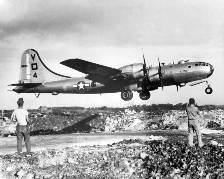 Two U.S. soldiers watching the takeoff of a B-29 bomber from the air base at Saipan, destination Tokyo. Saipan, 23rd November 1944 (Photo by Mondadori via Getty Images)