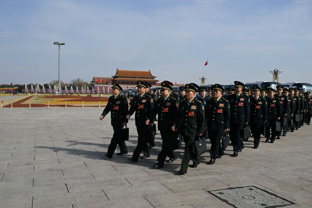 Military delegates arrive for a closed-door National People's Congress preparatory session for the third session of the 14th National People's Congress (NPC) at the Great Hall of the People in Beijing on March 4, 2025.