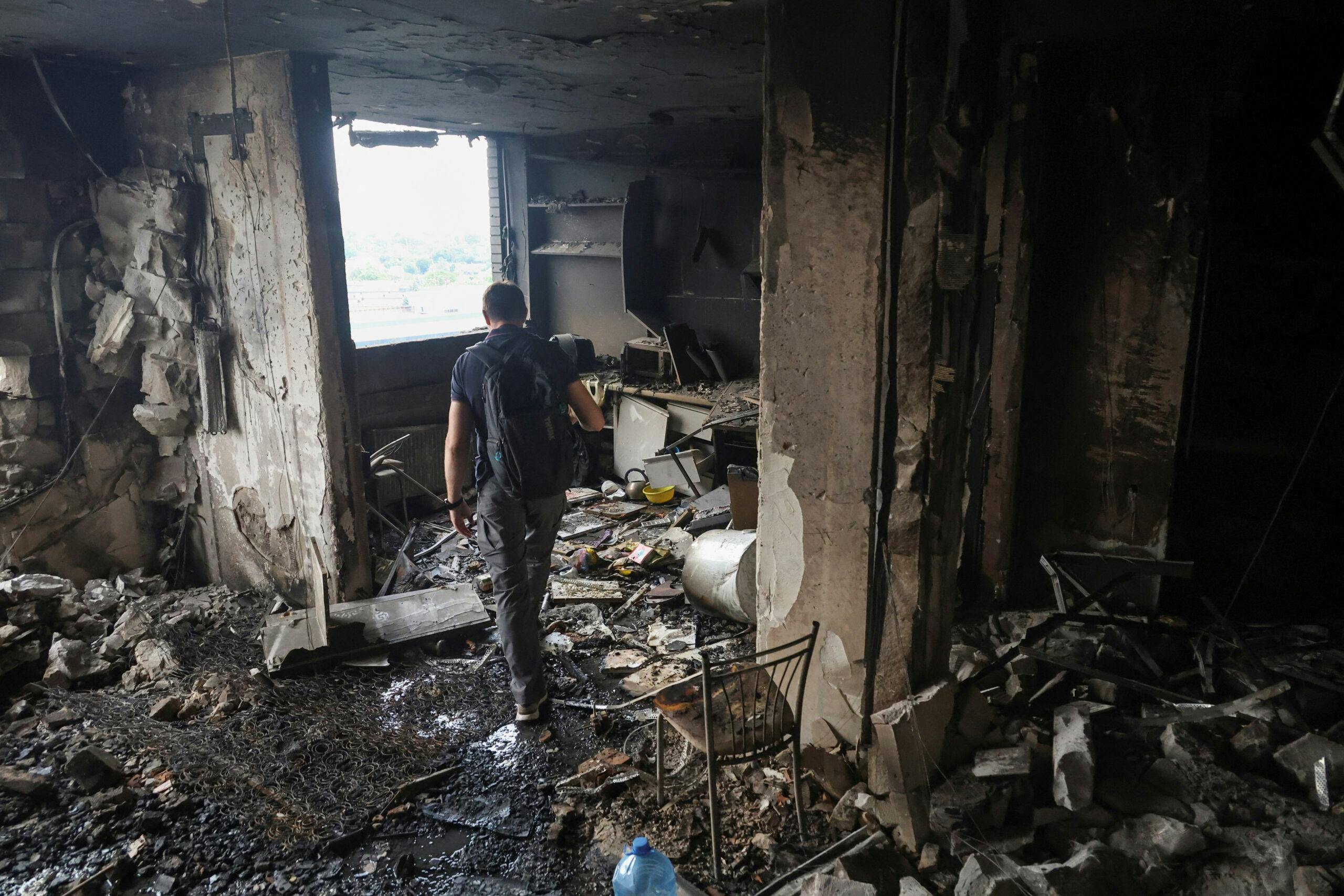 A resident walks inside his apartment building hit by a Russian drone strike, amid Russia's attack on Ukraine, in Odesa, Ukraine June 28, 2025.