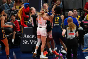 Indiana Fever guard Sophie Cunningham (8) and Connecticut Sun guard Jacy Sheldon (4) interact leading to Cunningham and Sheldon being ejected during a WNBA game between the Connecticut Sun and the Indiana Fever on June 17, 2025, at Gainbridge Fieldhouse in Indianapolis, IN.