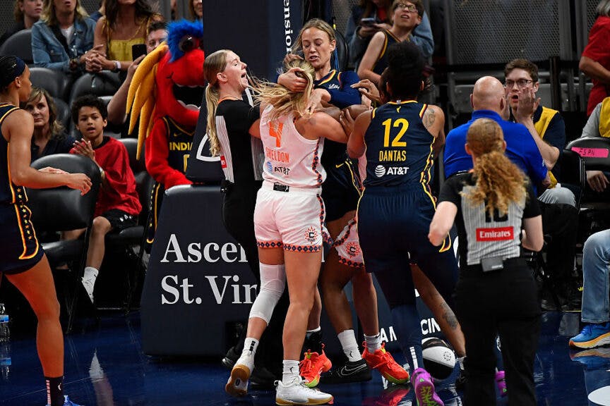 Indiana Fever guard Sophie Cunningham (8) and Connecticut Sun guard Jacy Sheldon (4) interact leading to Cunningham and Sheldon being ejected during a WNBA game between the Connecticut Sun and the Indiana Fever on June 17, 2025, at Gainbridge Fieldhouse in Indianapolis, IN.