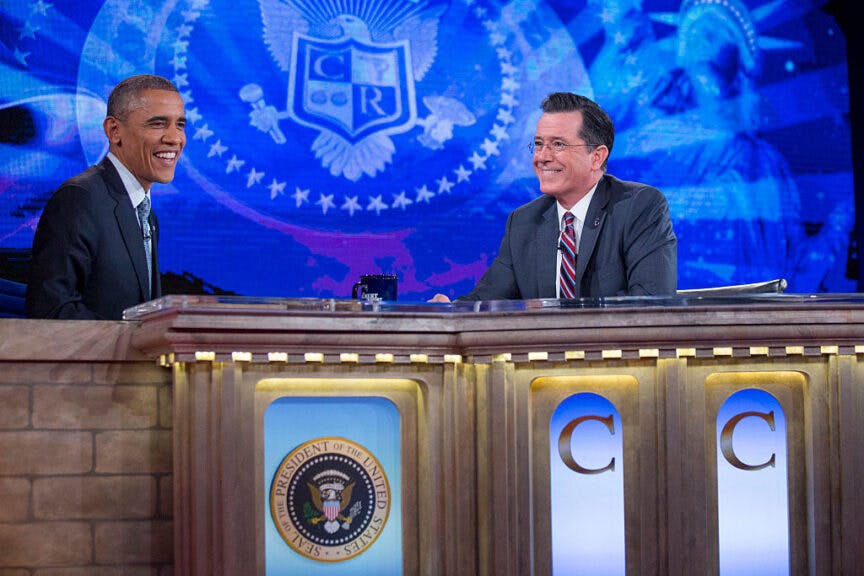 WASHINGTON, DC - DECEMBER 8: (AFP OUT) U.S. President Barack Obama (L) talks to television personality Stephen Colbert during a taping of Comedy Central's "The Colbert Report" in Lisner Auditorium at George Washington University on December 8, 2014 in Washington, DC. This is President Obama's third appearance on "The Colbert Report" that will broadcast its final show on Dec. 18. (Photo by Andrew Harrer-Pool/Getty Images)