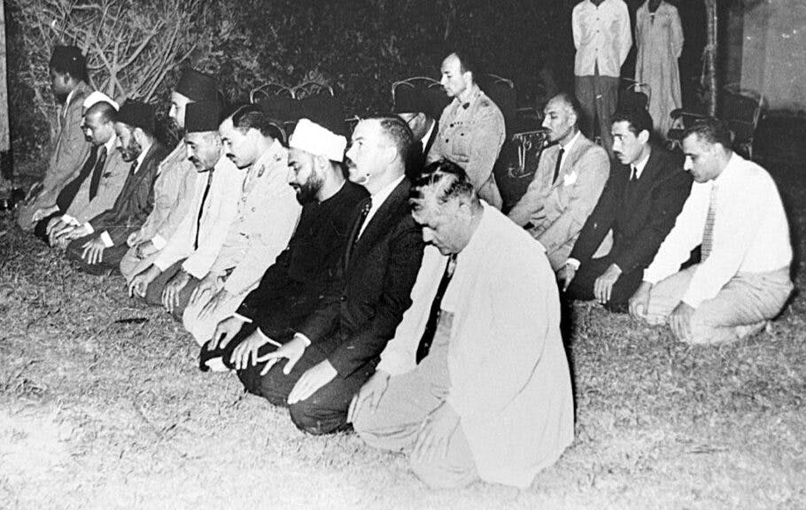 Picture from the 1950s shows Egyptian Gamal Abdel Nasser (R, 2nd row) and next to him his right hand man Abdel Hakim Amer, pray in Cairo with unidentified leaders of the Moslem Brotherhood. Nasser turned against the Brotherhood two years after the 1952 free officers revolution, sending scores of them to prison after accusing them of standing behind the failed attempt against his life. (Photo by AFP) (Photo by -/AFP via Getty Images)
