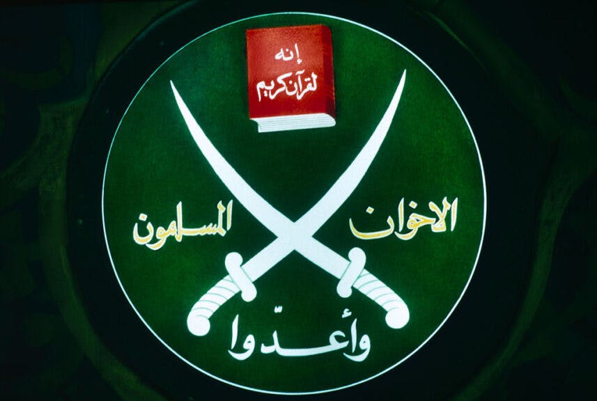 Emblem of the fundamentalist Islamic movement founded in 1928, Society of the Muslim Brothers, on display during a press conference in their Cairo office. (Photo by Maher Attar/Sygma via Getty Images)