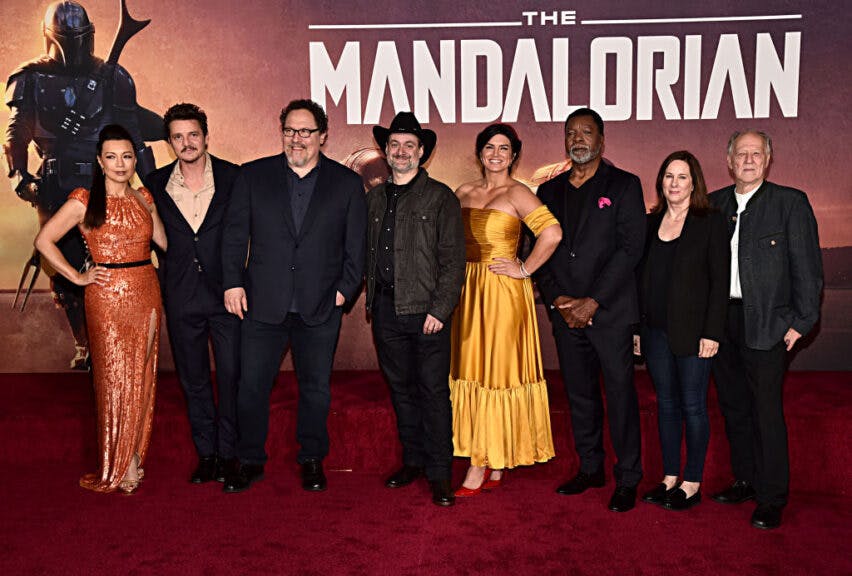 HOLLYWOOD, CALIFORNIA - NOVEMBER 13: (L-R) Ming-Na Wen, Pedro Pascal, Executive Producer Jon Favreau, Executive Producer/Director Dave Filoni, Gina Carano, Carl Weathers, Executive Producer Kathleen Kennedy and Werner Herzog arrive at the premiere of Lucasfilm's first-ever, live-action series, 