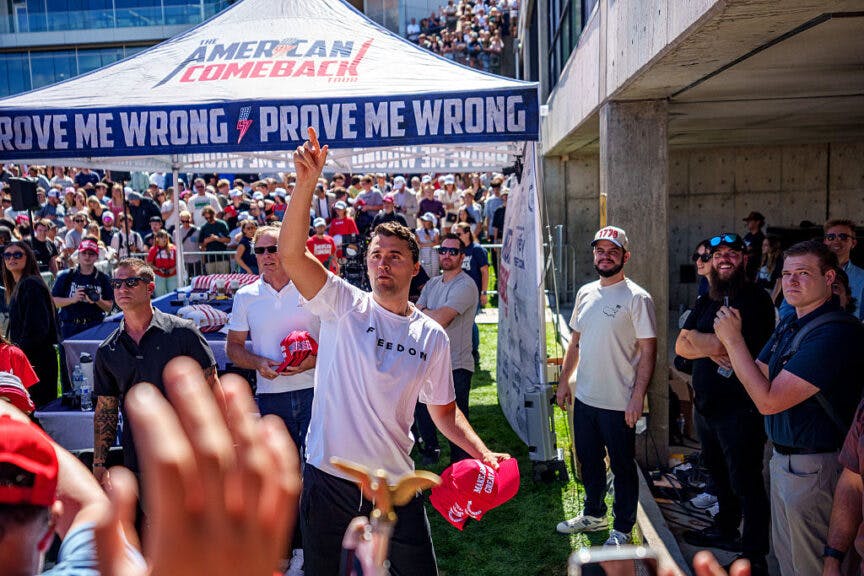 OREM, UTAH - SEPTEMBER 10: Charlie Kirk throws hats to the crowd after arriving at Utah Valley University on September 10, 2025 in Orem, Utah. Kirk, founder of Turning Point USA, was speaking at his "American Comeback Tour" when he was shot in the neck and killed.
