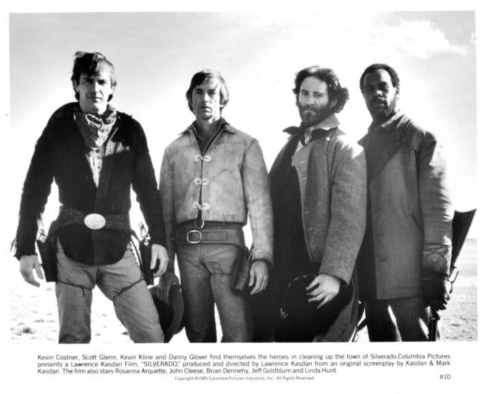 CIRCA 1985: Actors Kevin Costner, Scott Glenn, Kevin Kline and Danny Glover on set the movie "Silverado" circa 1985. (Photo by Michael Ochs Archives/Getty Images)