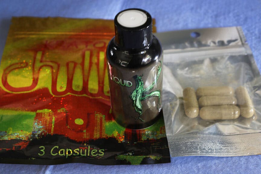In this photo illustration, a bottle with Kratom liquid and bags of capsules with the herbal supplement Kratom inside are seen on May 10, 2016 in Miami, Florida.