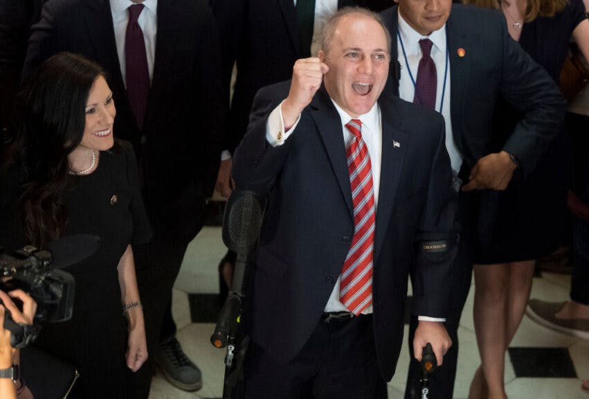 US Majority Whip Representative Steve Scalise, Republican of Louisiana, walks through Statuary Hall at the US Capitol in Washington, DC, September 28, 2017, as he returns to work after being injured in a shooting at the Republican Congressional baseball team practice on June 14.A beaming Scalise drew loud cheers, fist bumps, and multiple prolonged standing ovations when he walked using crutches onto the floor of the House of Representatives and addressed the chamber, three and a half months after he nearly died in an attack that also wounded three others and shocked the nation. / AFP PHOTO / SAUL LOEB (Photo credit should read SAUL LOEB/AFP via Getty Images)