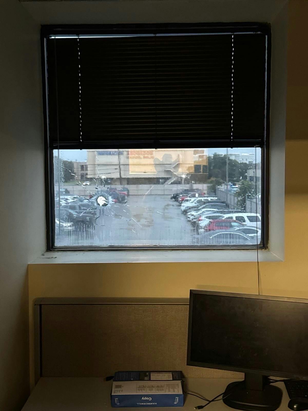 Photo obtained by The Daily Wire shows a bullet hole in the window of an ICE employee's office at the detention facility in Dallas.