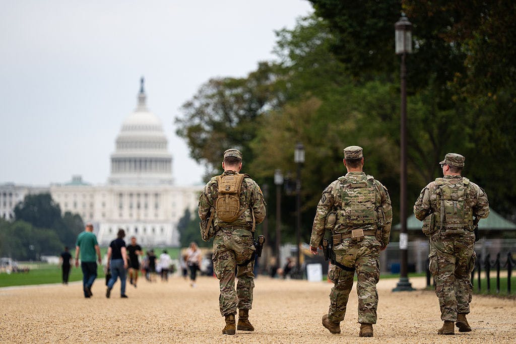 Members of the National Guard patrol near the US Capitol on the National Mall in Washington, DC, US, on Monday, Sept. 29, 2025. National Guard troops deployed to Washington, DC for President Donald Trump's
