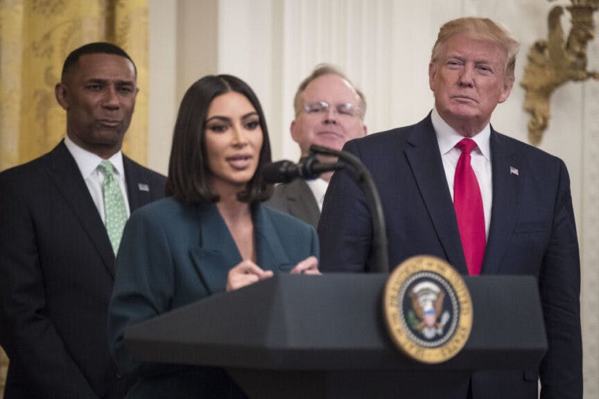 U.S. President Donald Trump, right, listens as reality star and activist Kim Kardashian West speaks about a second chance hiring and re-entry initiative at an event in the East Room of the White House in Washington, D.C., U.S., on Thursday June 13, 2019. Kardashian West took a star turn at the White House on Thursday to promote efforts to help those leaving prison get jobs and stay on track. Photographer: Sarah Silbiger/Bloomberg via Getty Images