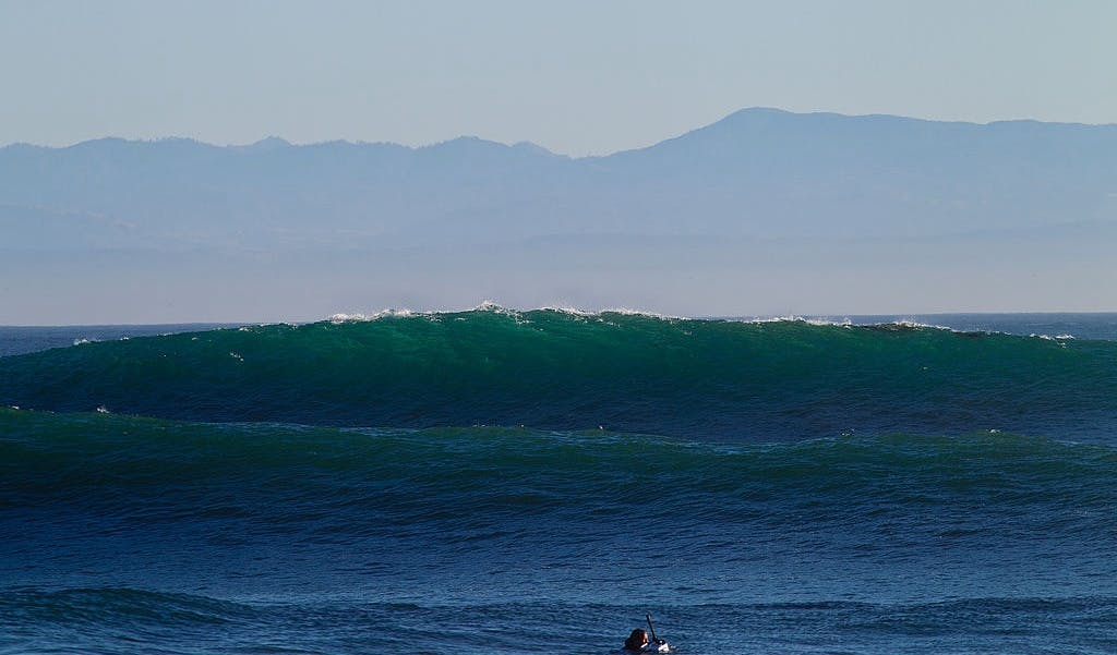 Surfers Rescue 6 People After Big Wave Capsizes Boat, Throws Family Into Ocean