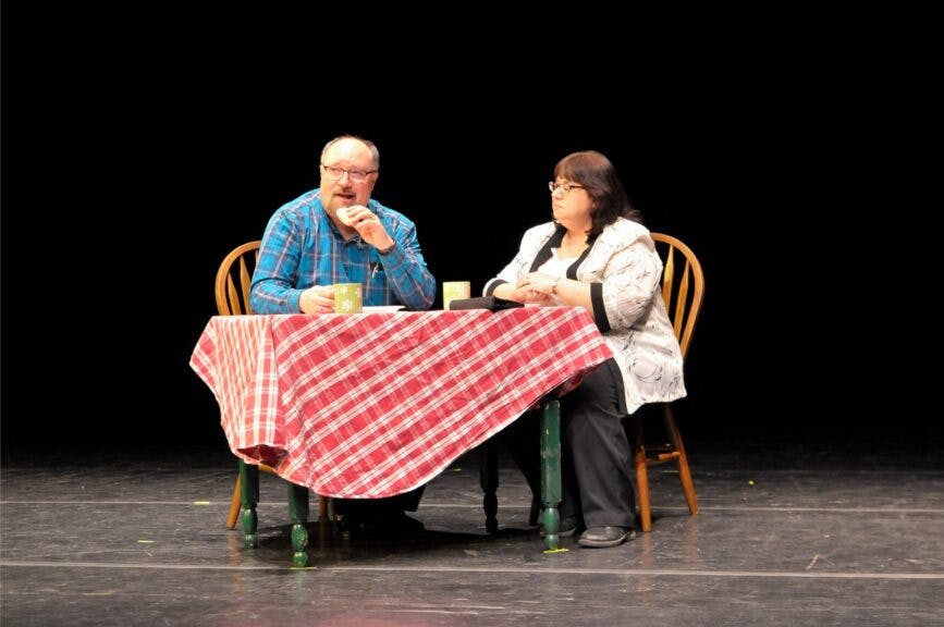 Donut Shop Dates.jpg: From my 2019 annual festival. That's me and my wife, Sandra, in the lead roles. The play, "Donut Shop Dates," is by Jeff Strausser.