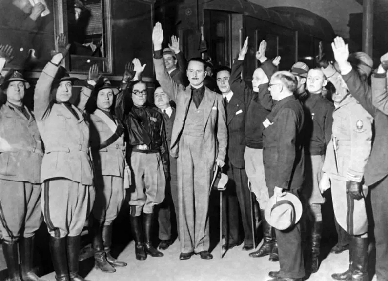 ROME, ITALY - APRIL 16: Arrival of Sir Oswald Mosley, leader of the British fascist party, at the railway station in Rome, Italy, on april 16, 1933: he was welcomed by Achille Starace, prominent leader of Fascist Italian party. (Photo by Gamma-Keystone via Getty Images)