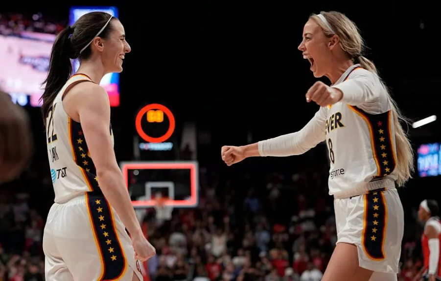 Caitlin Clark #22 of the Indiana Fever celebrates with Sophie Cunningham #8 after scoring the game-winning three pointer during the second half against the Washington Mystics at CareFirst Arena on June 08, 2026 in Washington, DC.