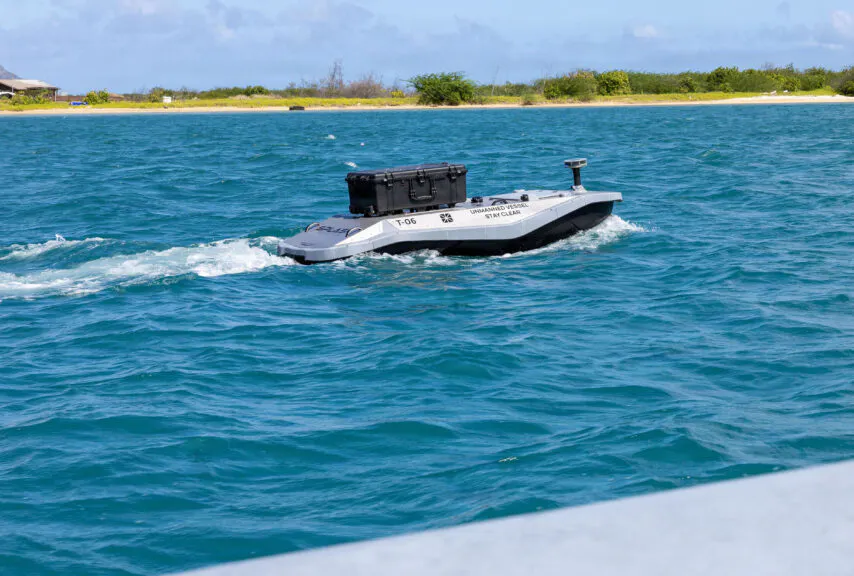 A digitally crewed surface vessel heads out to sea from Sand Island near Honolulu, Hawaii, to deliver parts for a 3D printer aboard Wasp-class amphibious assault ship USS Essex (LHD-2) during Exercise Rim of the Pacific 2026, July 7, 2026. Unmanned and remotely operated vessels extend the capability of interconnected manned platform sensors to enhance capacity across the multinational force. Thirty nations, over 30 surface ships, five submarines, 15 national land forces, more than 206 aircraft and 30,000 personnel are participating in RIMPAC in and around the Hawaiian Islands, June 24 to July 31. The world's largest international maritime exercise, RIMPAC provides a unique training opportunity while fostering and sustaining cooperative relationships among participants critical to ensuring the safety of sea lanes and security on the world's oceans. RIMPAC 2026 is the 30th exercise in the series that began in 1971. (Navy photo by Mass Communications Specialist 3rd Class Charles Harbour)