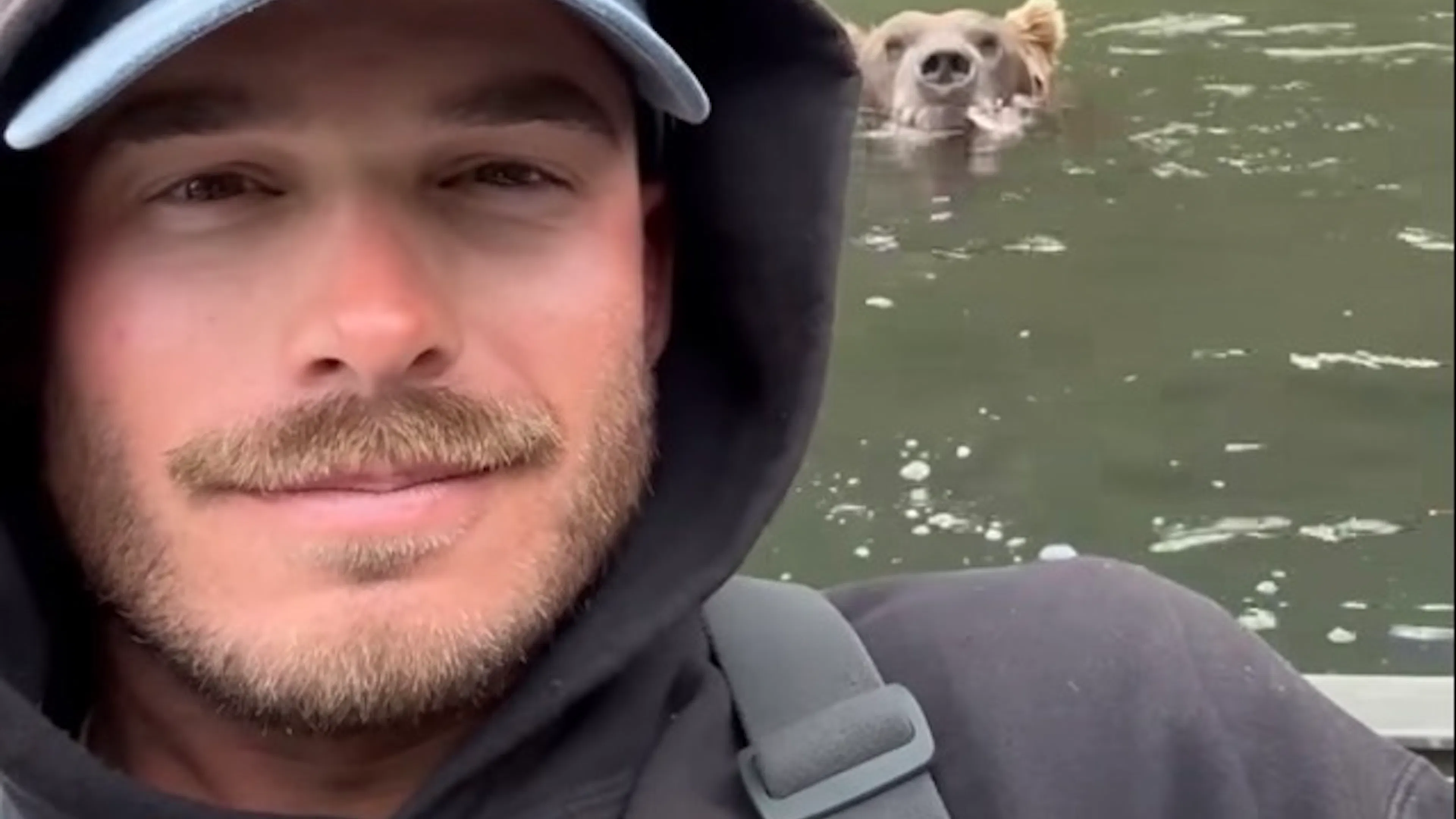 WATCH: Massive Brown Bear Comes Within Feet Of Fisherman To Grab Salmon