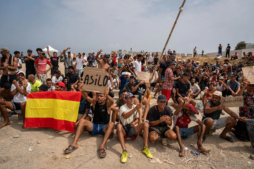 Hundreds Of Illegal Migrants Demand Asylum After Storming Spanish Beach