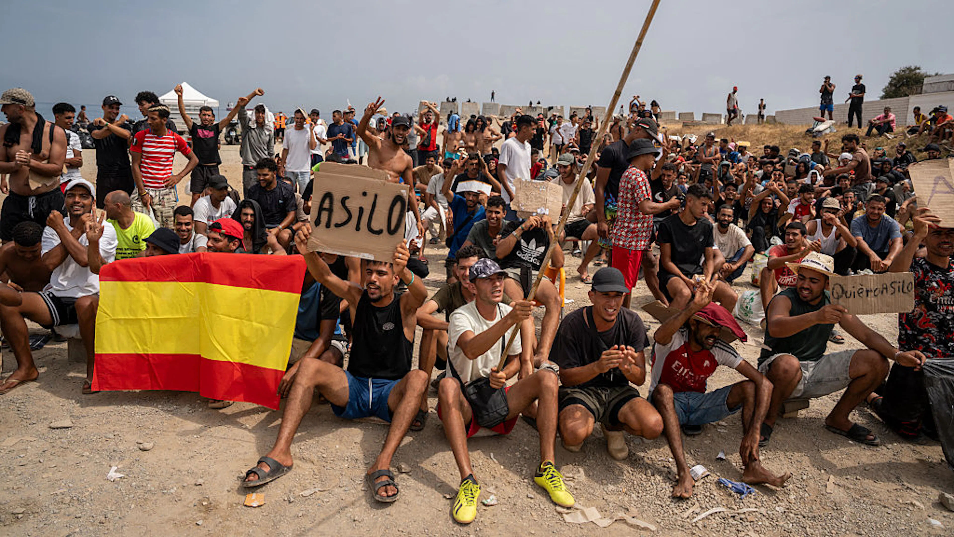 Hundreds Of Illegal Migrants Demand Asylum After Storming Spanish Beach