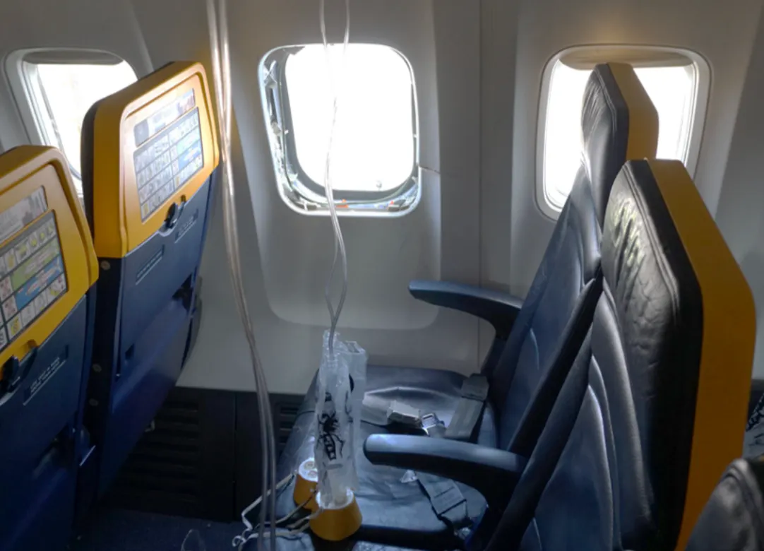 Passenger Saved From Getting Sucked Out Of Plane After Midair Disaster